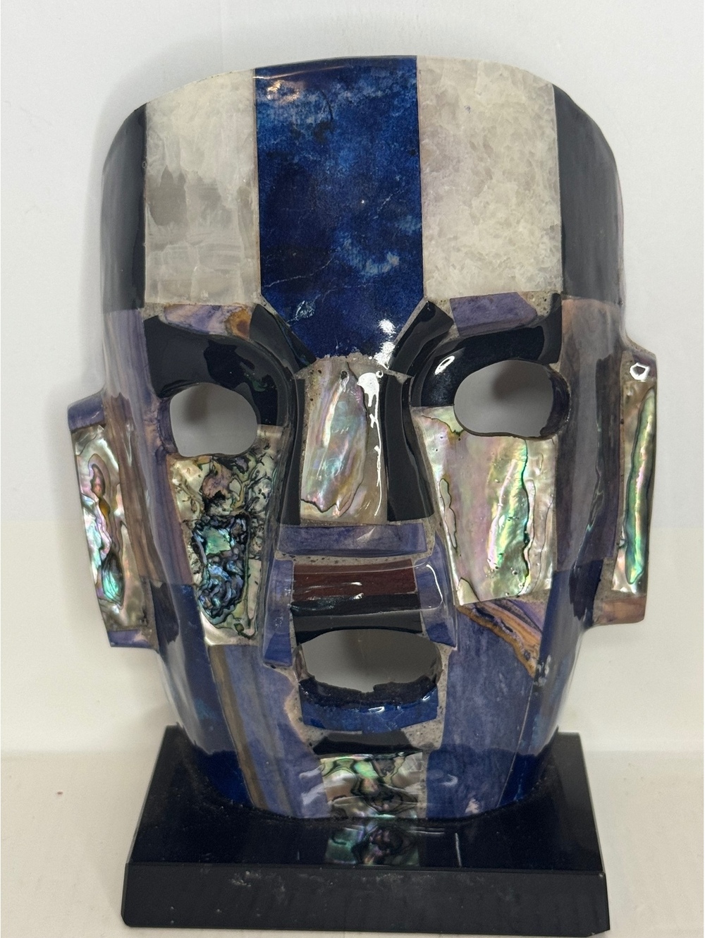Iridescent ceramic face mask sculpture